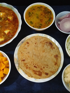 A picture of Mutter paneer, paratha with zeera rice and dalfry.