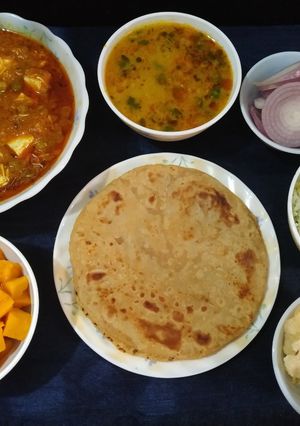A picture of Mutter paneer, paratha with zeera rice and dalfry.