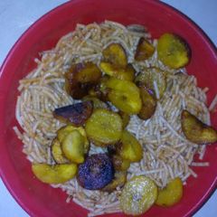 A picture of Spagetti with fried plantain.