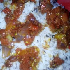 A picture of Rice and beans with peppered sauce.