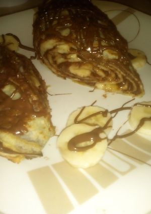 O poză a rețetei Ruladă din clătite cu Nutella și banane.