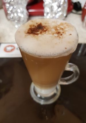 A picture of My Americano Frothy Coffee yummy with chocolate sprinkles 😋.