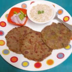 A picture of Bottle Gourd Ka Paratha With Smoky Sannata Raita = A UP - Bihar Special.
