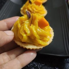 A picture of Cute Little "mango Sev Burfi short Bread Tart".