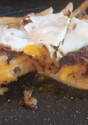 Una foto de Papas con cheddar