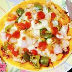 A picture of Healthy Oats and wheat flour pizza with cottage cheese.