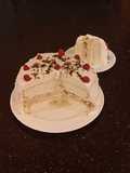 White Layer Cake with a Raspberry Swirl Cheesecake center layer and a Raspberry Cream Frosting