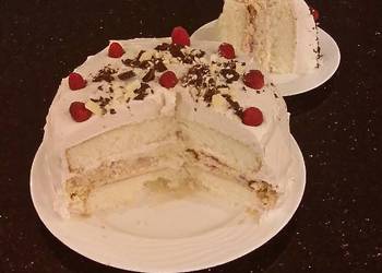 The New Way Make Recipe White Layer Cake with a Raspberry Swirl Cheesecake center layer and a Raspberry Cream Frosting Home Style