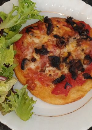 A picture of Potato pizzas with a little diffence.