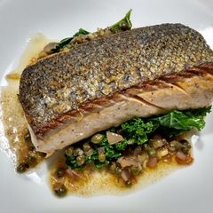 A picture of Crispy-skinned salmon with brown butter and capers.