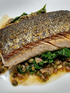 A picture of Crispy-skinned salmon with brown butter and capers.