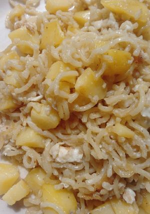 A picture of Noodles with potatoes and egg.