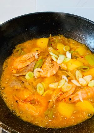 A picture of Kimchi, Pork, Prawn, Chili and Potato Stew.
