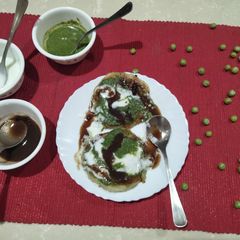 A picture of Aloo Tikki stuffed with green Peas.