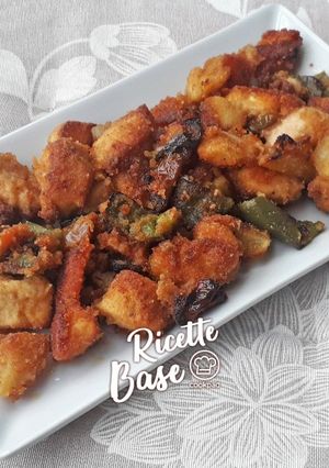 Foto di Pollo sabbioso con patate e peperoni