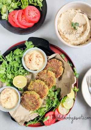 A picture of Falafel patties with home-made hummus.
