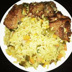 A picture of Fried rice and  chicken.