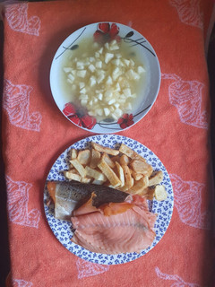 A picture of Smoked Salmon and chips with Apple Sauce.