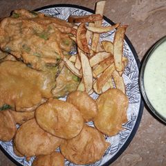 A picture of 3 types of Pakoras with Mint yogurt.