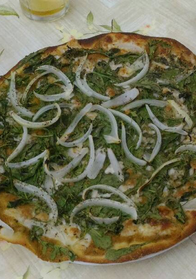 Una foto de Pizza de hummus