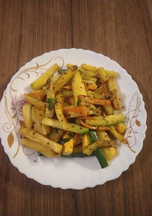 A picture of Zucchini and carrot stir fry.