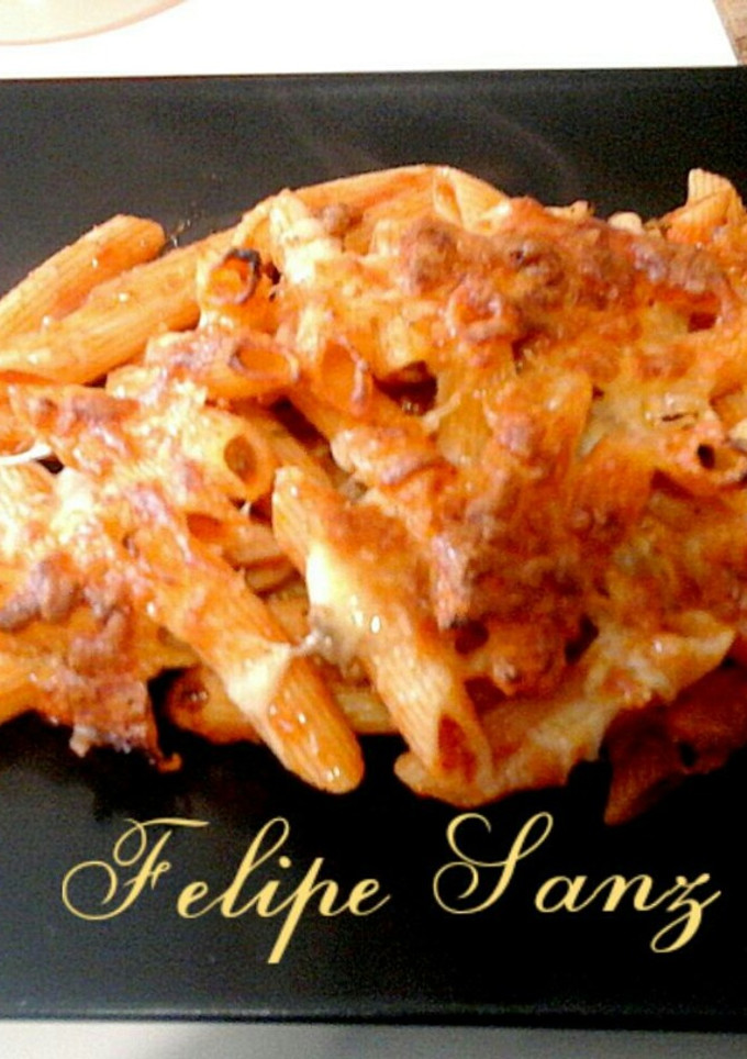 Una foto de Penne a la Boloñesa gratinados