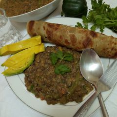 A picture of Spicy lentils (kamande)in milk and cinnamon raisins chapati.