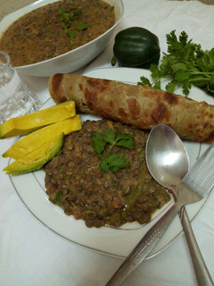 A picture of Spicy lentils (kamande)in milk and cinnamon raisins chapati.