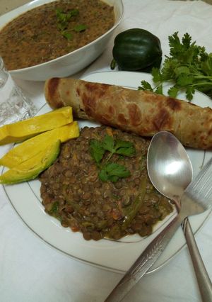 A picture of Spicy lentils (kamande)in milk and cinnamon raisins chapati.