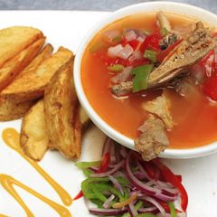A picture of Kuku kienyeji and fried potatoes.