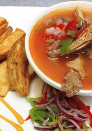 A picture of Kuku kienyeji and fried potatoes.