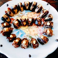 A picture of Delicious nutritious stuffed dates with mava peanut Honey dry fruits delight.
