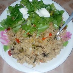 A picture of Jallop rice with dry cat fish&lettus.