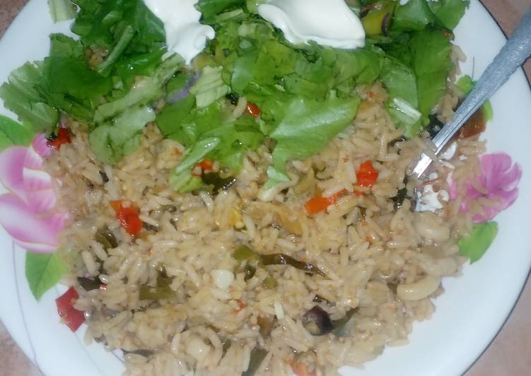 Jallop rice with dry cat fish&amp;lettus