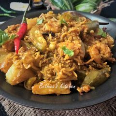 A picture of Chaal Chingri Potol (Parwal / Pointed Gourd Cooked With Prawns & Rice - Bengali style).