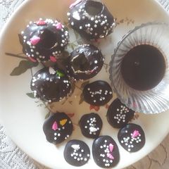 A picture of Dark chocolate puchkas with chilled chocolate milk shake and chocolate disc.