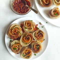 Vegan Rose shaped Dumplings with Homemade Chilli Oil A picture of Vegan Rose shaped Dumplings with Homemade Chilli Oil.