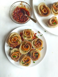 A picture of Vegan Rose shaped Dumplings with Homemade Chilli Oil.