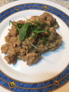 Una foto de Arroz cremoso de lomo de cerdo y champiñones