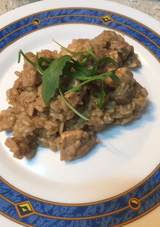 Una foto de Arroz cremoso de lomo de cerdo y champiñones