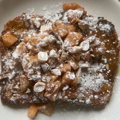 French toast, with caramelsauce, baked apple and nuts A picture of French toast, with caramelsauce, baked apple and nuts.