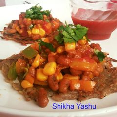 A picture of Mexican sopes (Base with grated Potatoes and filling with corn bean chaat).