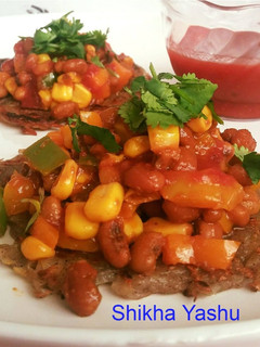 A picture of Mexican sopes (Base with grated Potatoes and filling with corn bean chaat).