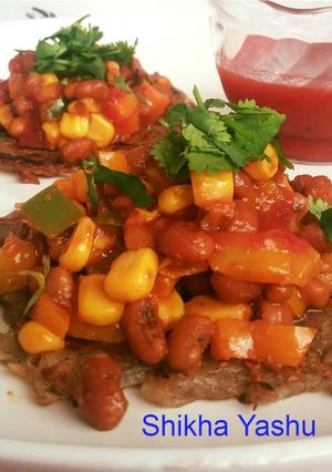 A picture of Mexican sopes (Base with grated Potatoes and filling with corn bean chaat).