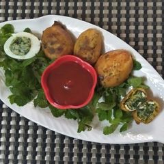 A picture of Egg spinach bonda.