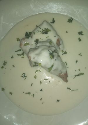 Una foto de Costilla de puerco bañada en salsa bechamel