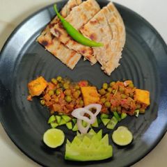 A picture of Muttor paneer with laccha paratha.