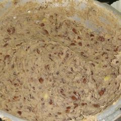 Njahi (black beans) mashed in bananas A picture of Njahi (black beans) mashed in bananas.
