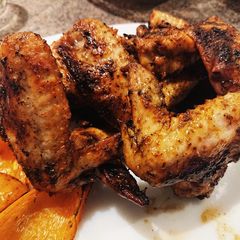 A picture of Spicy Chicken Wings With A Butter Sauce Coating.