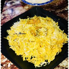 A picture of Mutton dum biryani & salad.